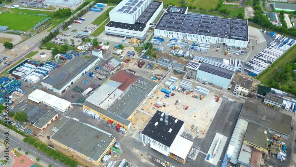 Aerial view of distribution center, drone photo of industrial logistics zone,new super modern logistics center full of modern technology and robotics,roof solar power plant for green energy production Aerial view of distribution center, drone photo of industrial logistics zone,new super modern logistics center full of modern technology and robotics,roof solar power plant for green energy production
