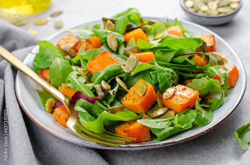 Pumpkin Salad with Arugula and Pumpkin Seeds, Salad Mix with Roasted Pumpkin, Fresh Vegan Autumn Salad