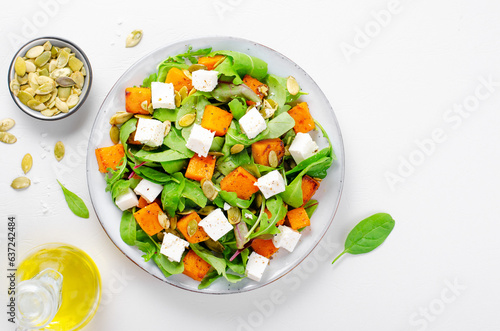 Pumpkin Salad with Arugula, Feta Cheese, and Pumpkin Seeds, Salad Mix with Roasted Pumpkin, Autumn Salad