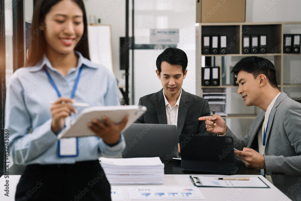 Businessmen team or financial data analysts working with tablets and laptop computers and data graphs together. Plan to analyzing projects in the office. Businessmen team or financial data analysts working with tablets and laptop computers and data graphs together. Plan to analyzing projects in the office.