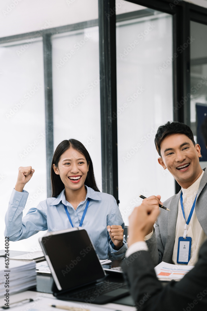 Happy smiling businessman feel happy work complete Teamwork success, success at work in the office concept. Happy smiling businessman feel happy work complete Teamwork success, success at work in the office concept.