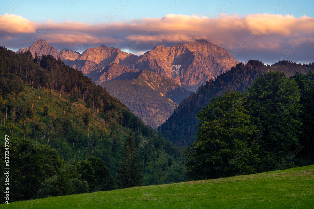 Peaks of the High Tatras photographed from a mountain glade at sunset