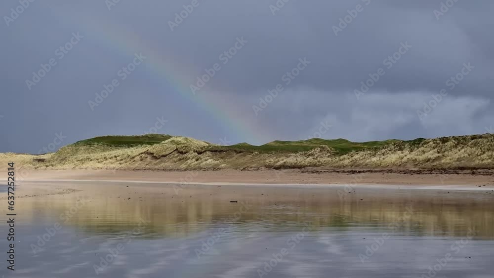 Beautiful rainbow and pattern at Narin beach by Portnoo, County Donegal, Ireland Beautiful rainbow and pattern at Narin beach by Portnoo, County Donegal, Ireland