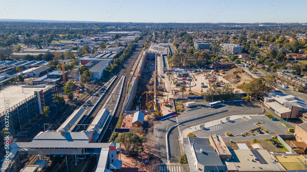 Fototapeta premium Aerial drone view of the construction site of the new metro station at St Marys in Western Sydney, NSW Australia on a sunny day in August 2023