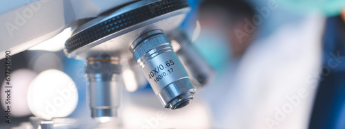 Obraz na plátně professional chemist woman laboratory using scientific microscope for science re