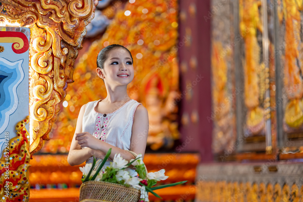 Portrait Of A Beautiful Woman Wearing A Traditional Thai Dress Smiling portrait-of-a-beautiful-woman-wearing-a-traditional-thai-dress-smiling