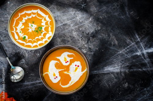 Pumpkin Soup, Halloween Cream Soup on Dark Cobweb Background