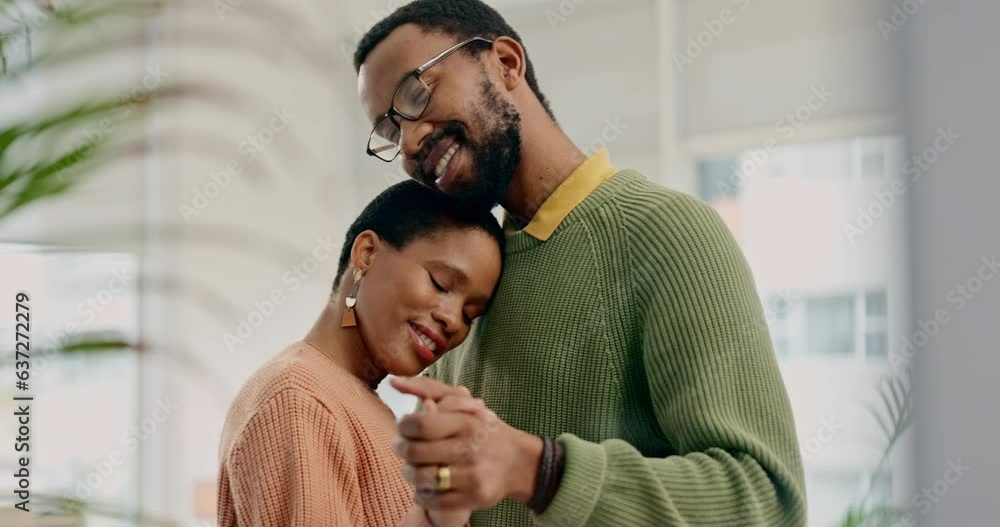 Black couple, dancing and hug with peace and love while at home, trust and support in marriage with bonding. Happiness, calm and care with people and rhythm, life partner and healthy relationship Black couple, dancing and hug with peace and love while at home, trust and support in marriage with bonding. Happiness, calm and care with people and rhythm, life partner and healthy relationship