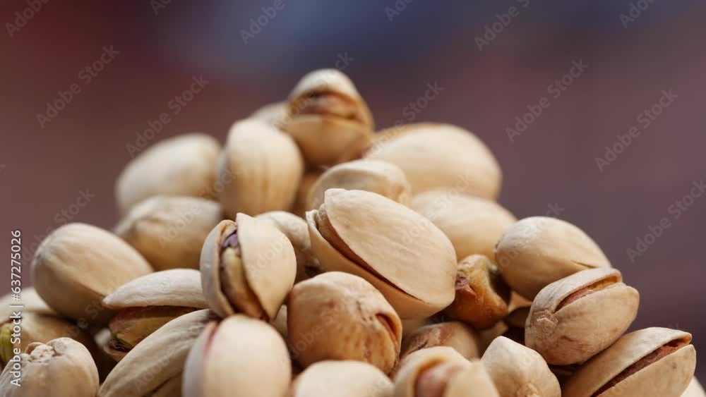 A pile of pistachios on a table A pile of pistachios on a table