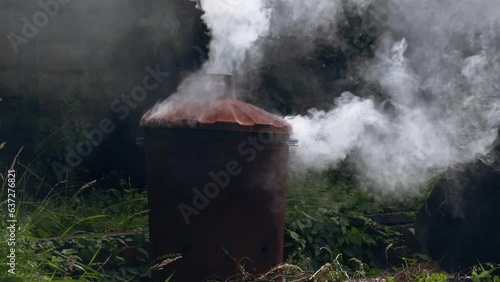 Garden and house garbage burning in a bin incinerator