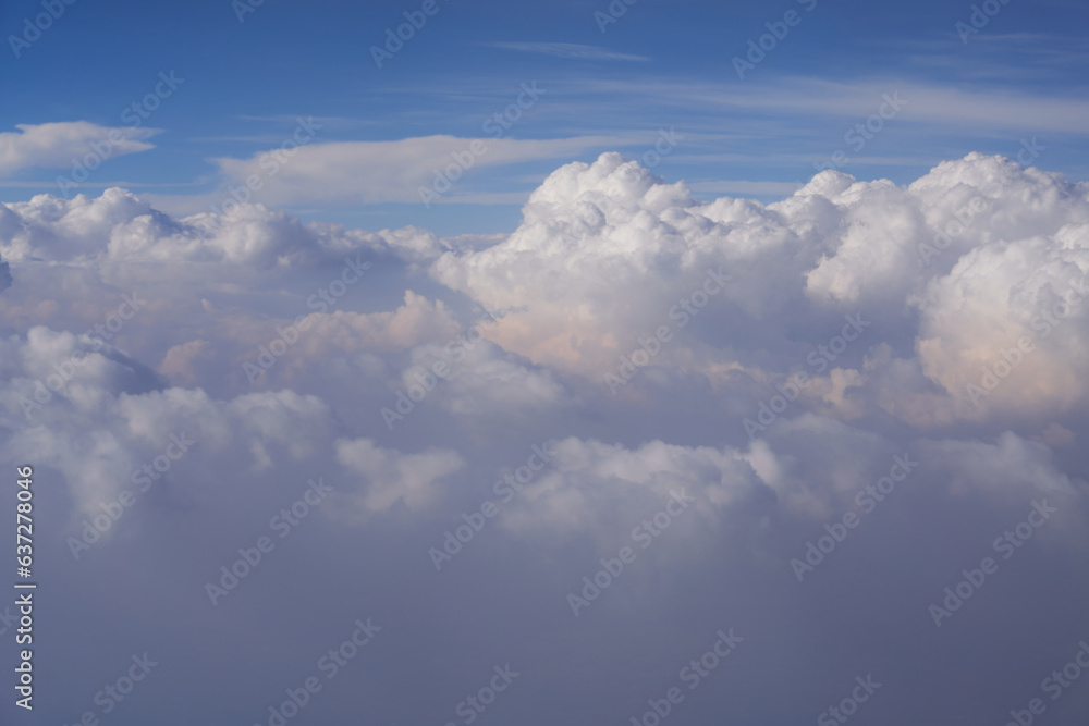 Clouds and blue sky as seen from an airplane