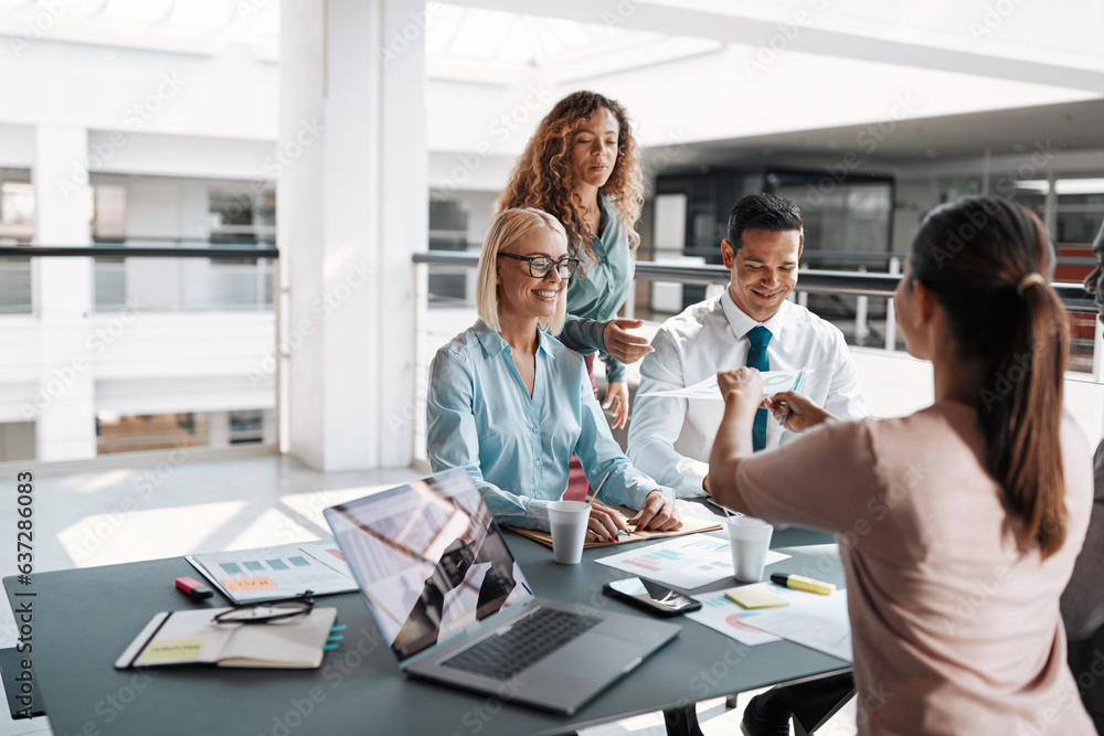 © Flamingo Images - Smiling group of diverse businesspeople having a meeting