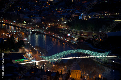 night illumination of peace bridge in georgia © Надежда Долгова
