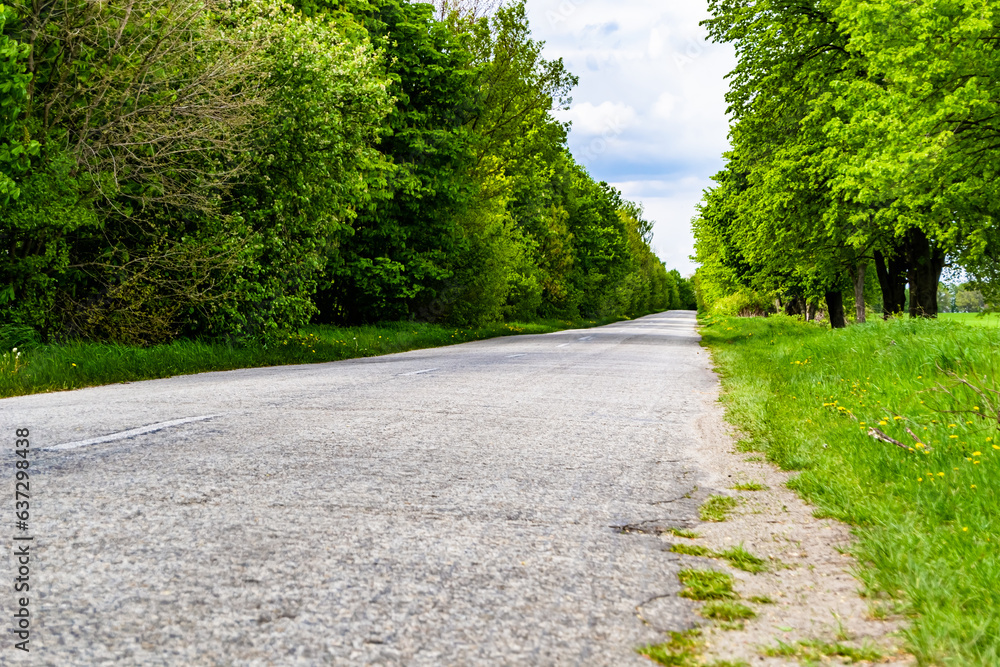 Beautiful empty asphalt road in countryside on colored background Beautiful empty asphalt road in countryside on colored background