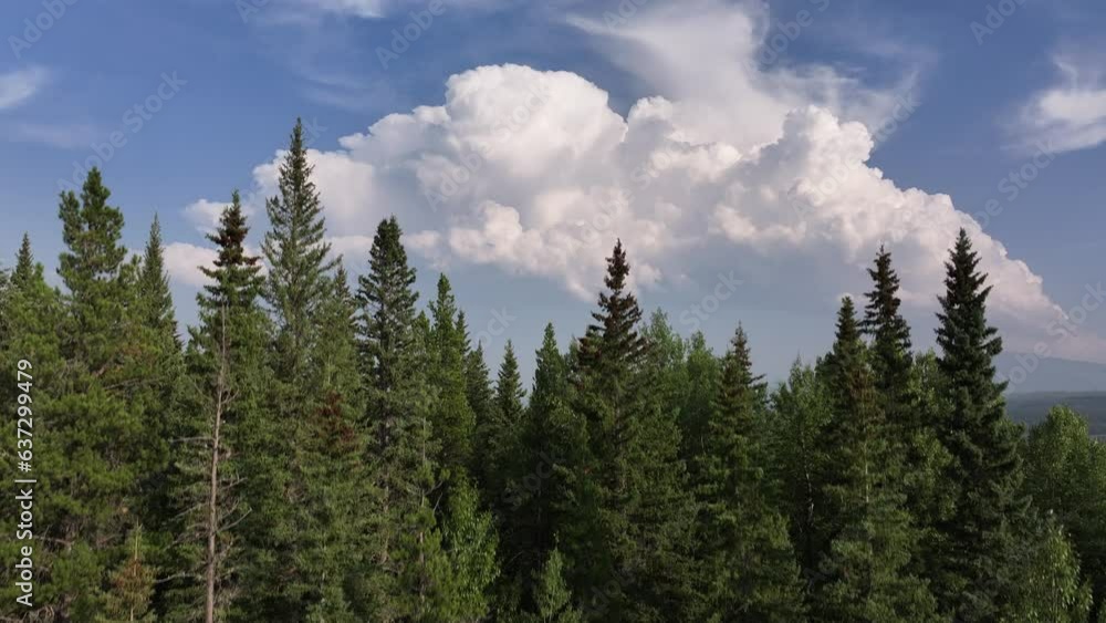 Rising drone video reveals a distant thunder storm over the foothills of Alberta, Canada Rising drone video reveals a distant thunder storm over the foothills of Alberta, Canada