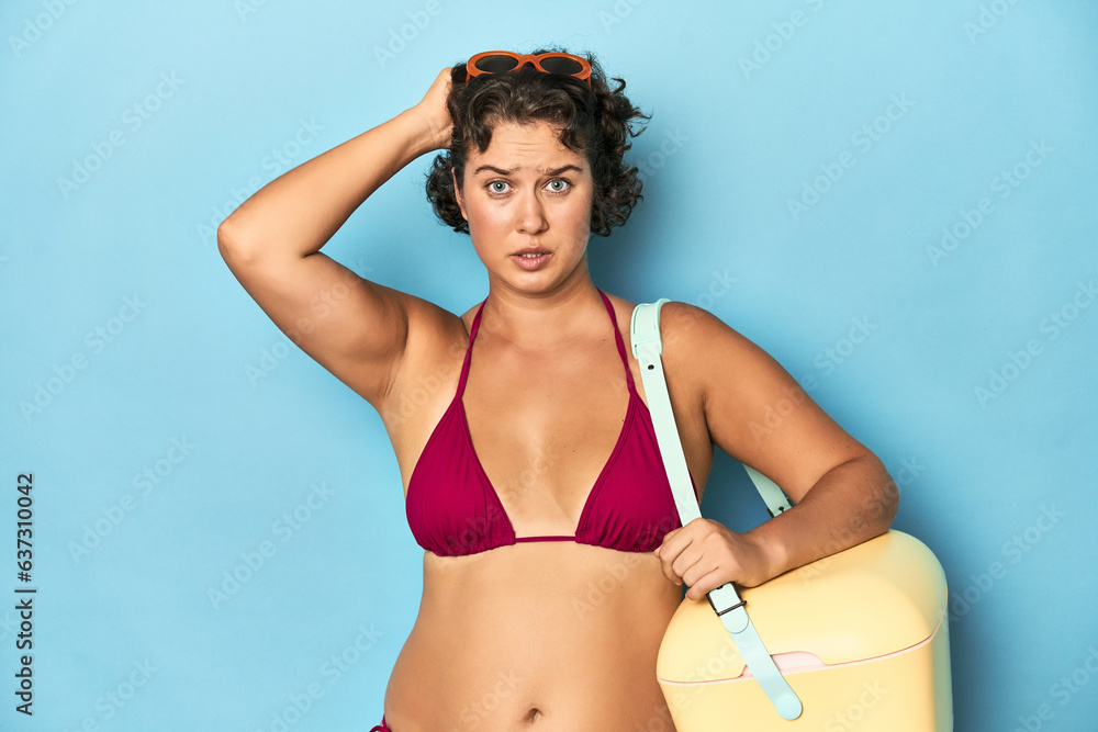 Young woman with cooler and summer look being shocked, she has remembered important meeting.