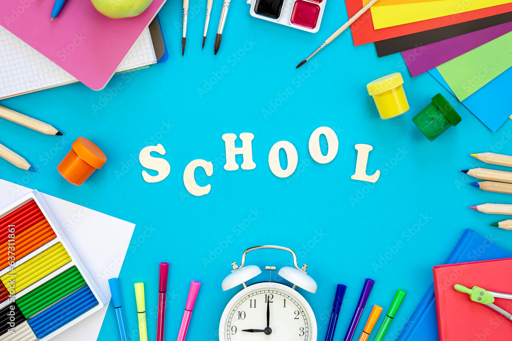 Colourful school supplies on a blue background, back to school concept. Colourful school supplies on a blue background, back to school concept.