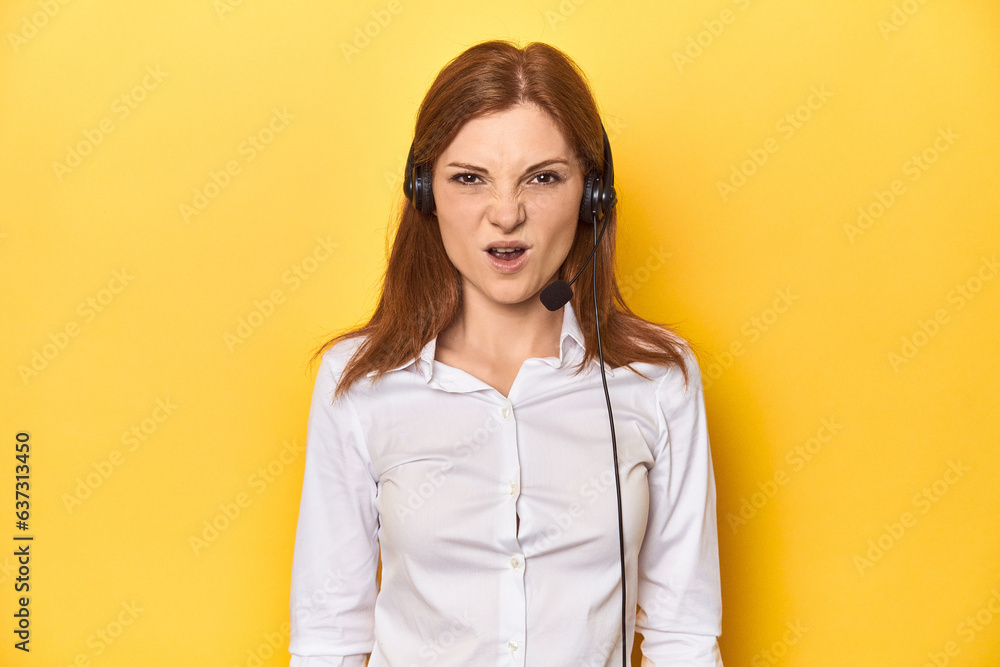 Call center redhead in white shirt, headphones on screaming very angry and aggressive. Call center redhead in white shirt, headphones on screaming very angry and aggressive.