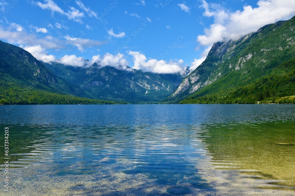 Scenic view of Bohinj lake in summer and mountain above in Julian alps, Gorenjska, Slovenia