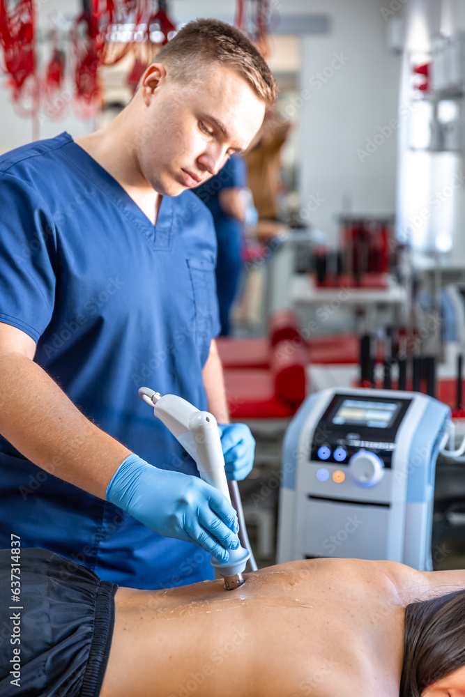 Extracorporeal shockwave therapy, physical therapy for neck and back muscles. Extracorporeal shockwave therapy, physical therapy for neck and back muscles.