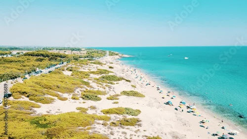 Salento, spiaggia di Campomarino di Maruggio con le dune e le acque turchesi cristalline, in estate - Puglia, Taranto, italy photo