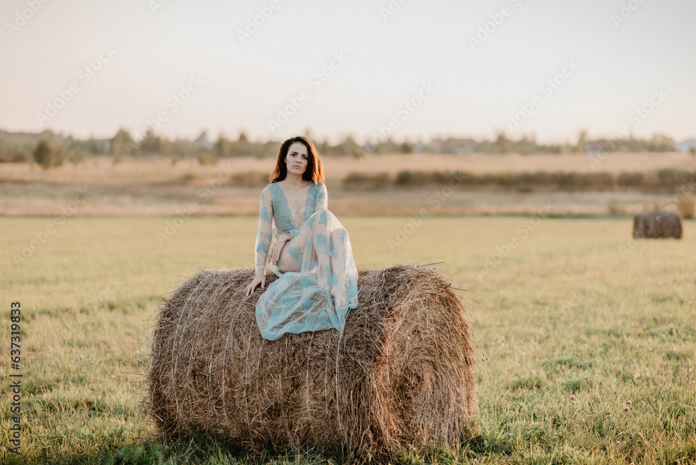 sexy young topless nude girl sitting on a haystack in a field in summer. Added the effect of a small film grain sexy young topless nude girl sitting on a haystack in a field in summer. Added the effect of a small film grain