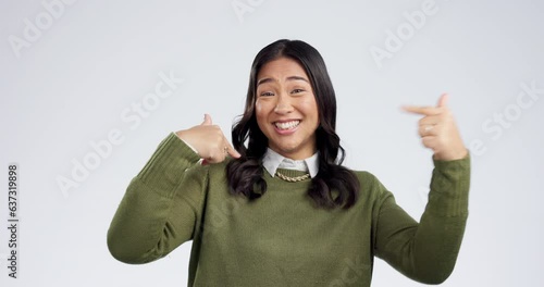 Woman face, pointing finger and choose me with a smile and proud from motivation. Studio, white background and portrait with confidence and myself and decision hand gesture of happy female person