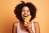 Happiness African Girl Holds And Eats Taco On Pastel Background. Happiness, African Girls, Taco Eating, Pastel Background