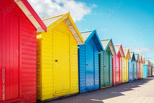 Obraz na płótnie Beach huts or bathing houses on the beach with blue sky background
