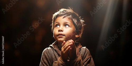Childhood Faith: A photo of a boy praying, symbolizing the innocence and purity of faith.