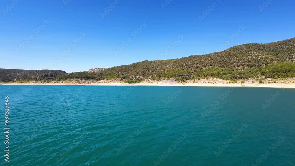Top view of the beautiful azure lake. Aerial shot of the lake from a drone. Lake seen from a bird's-eye view. 4K. Top view of the beautiful azure lake. Aerial shot of the lake from a drone. Lake seen from a bird's-eye view. 4K.