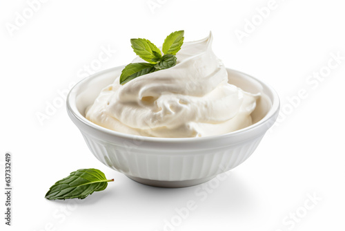 a bowl of whipped cream with mint leaves