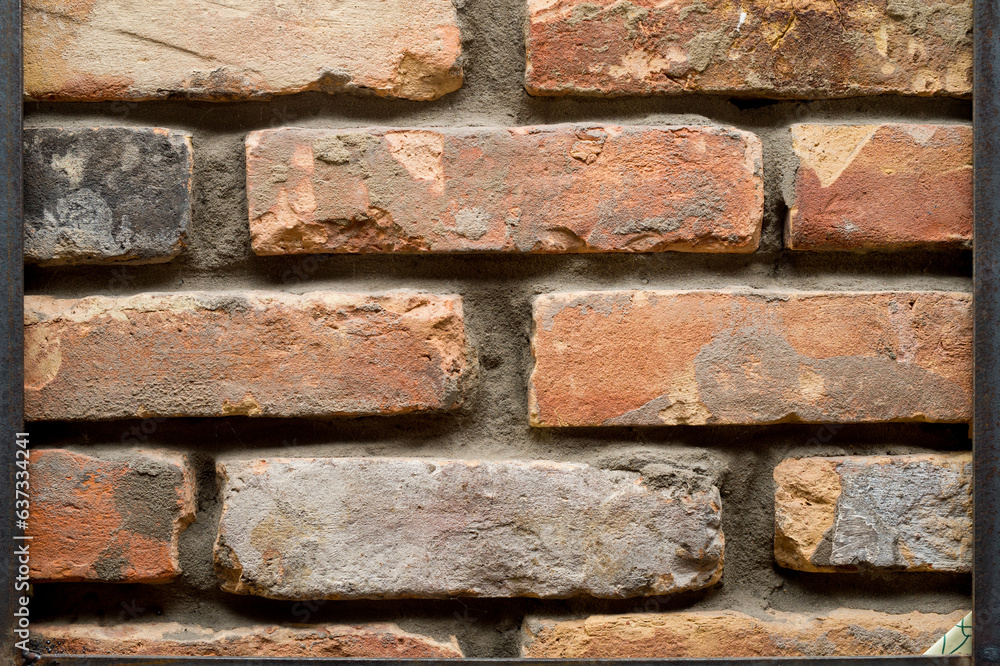 Fragment of a brick wall made of red old bricks. Fragment of a brick wall made of red old bricks.
