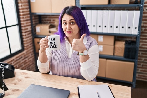 Fotografie Plus size woman wit purple hair working at small business ecommerce holding i am