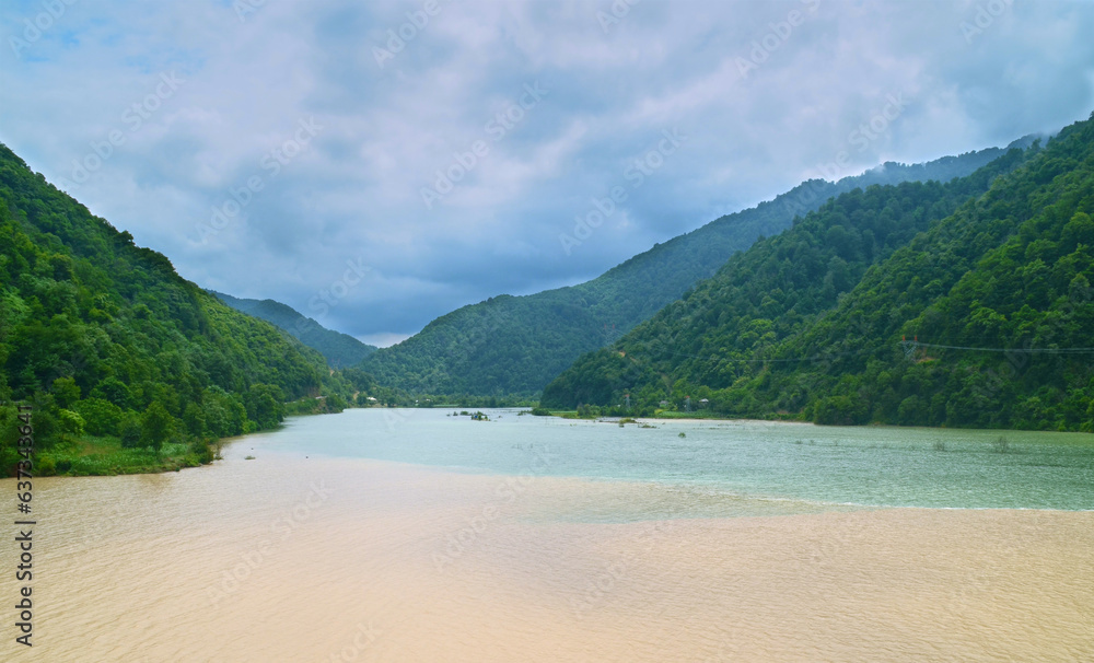 Confluence of rivers Chorokh and Adjaristsqali surrounded by mountains landscape view. Travel, travelling, tourism, landscape, nature photography. Adjara, Georgia.