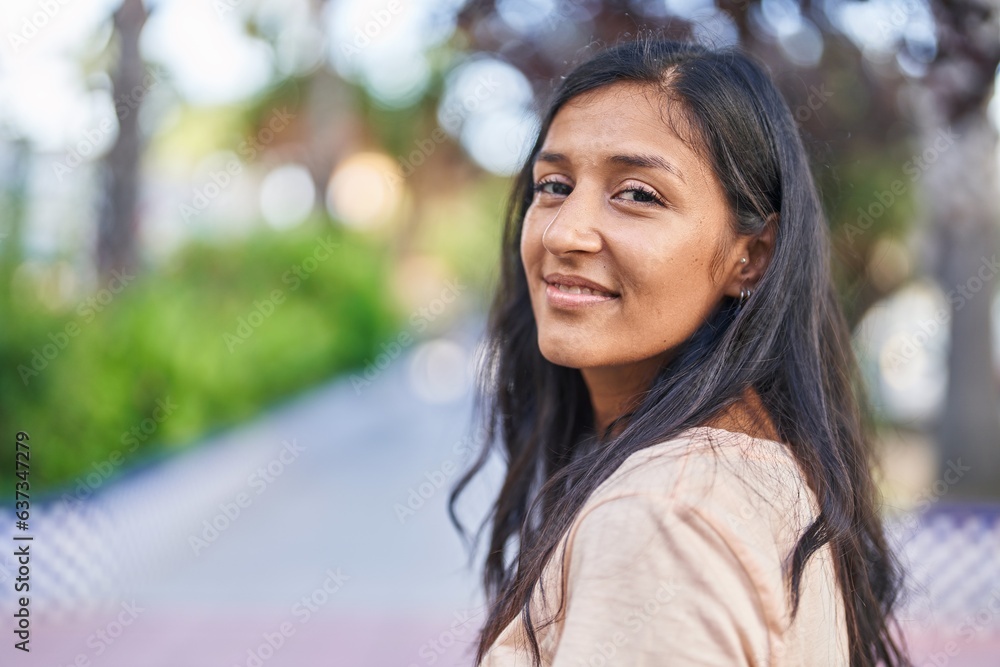 Young beautiful hispanic woman smiling confident standing at park Young beautiful hispanic woman smiling confident standing at park