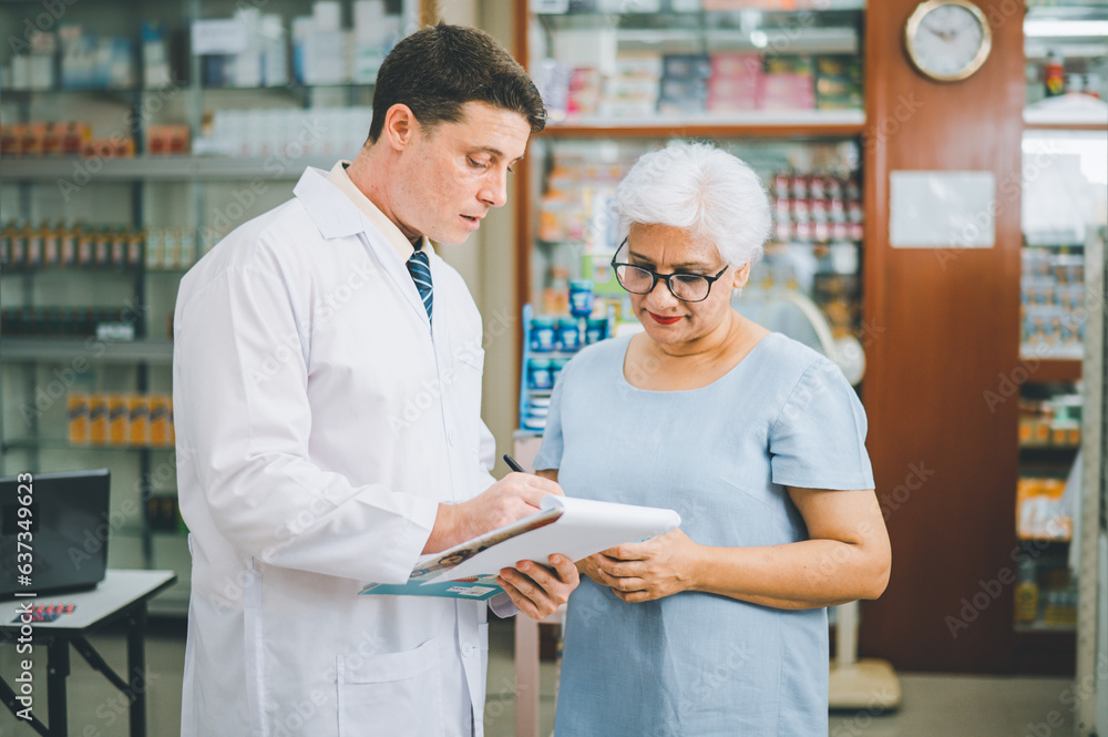 Pharmacist giving advice And advice for patients who come to buy Medicine, Drugs, Vitamins products, according to prescriptions in modern pharmacies.