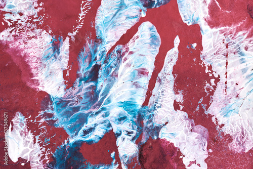 Exclusive beautiful pattern, abstract fluid art background. Flow of blending red blue white paints mixing together. Blots and streaks of ink texture for print and design