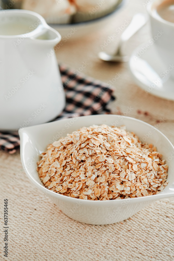 bowl with some rolled oats on a table bowl with some rolled oats on a table