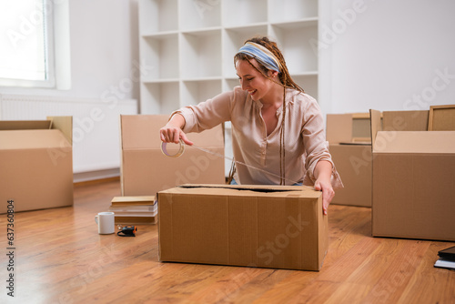 Modern ginger woman with braids moving into new home.