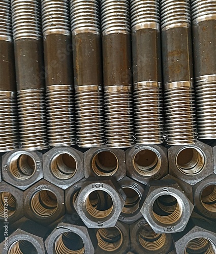 a set of bolts and nuts lies on the table