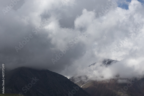 mountain landscape. clouds over peaks.