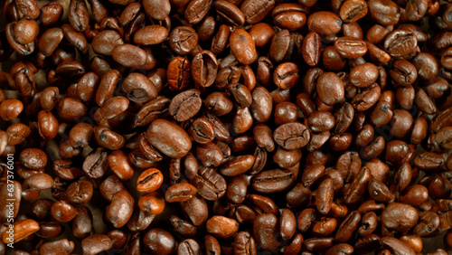 Freeze Motion Shot of Flying and Rotating Coffee Beans, Dark Background