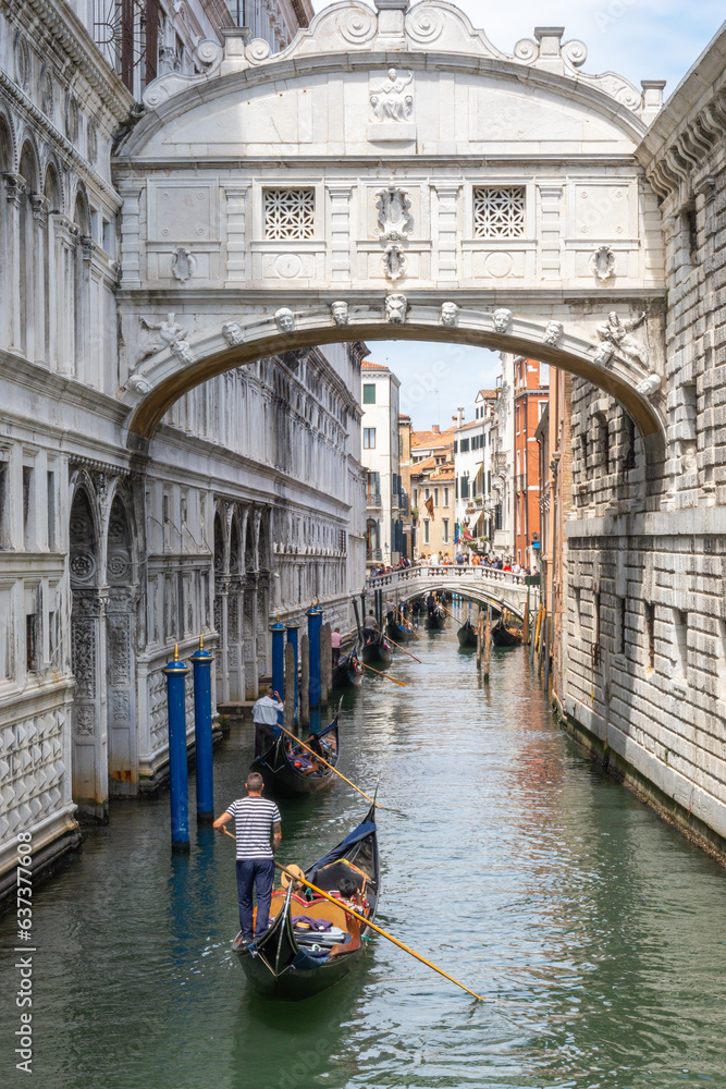 Gondola sailing below the Bridge of Sighs in Venice