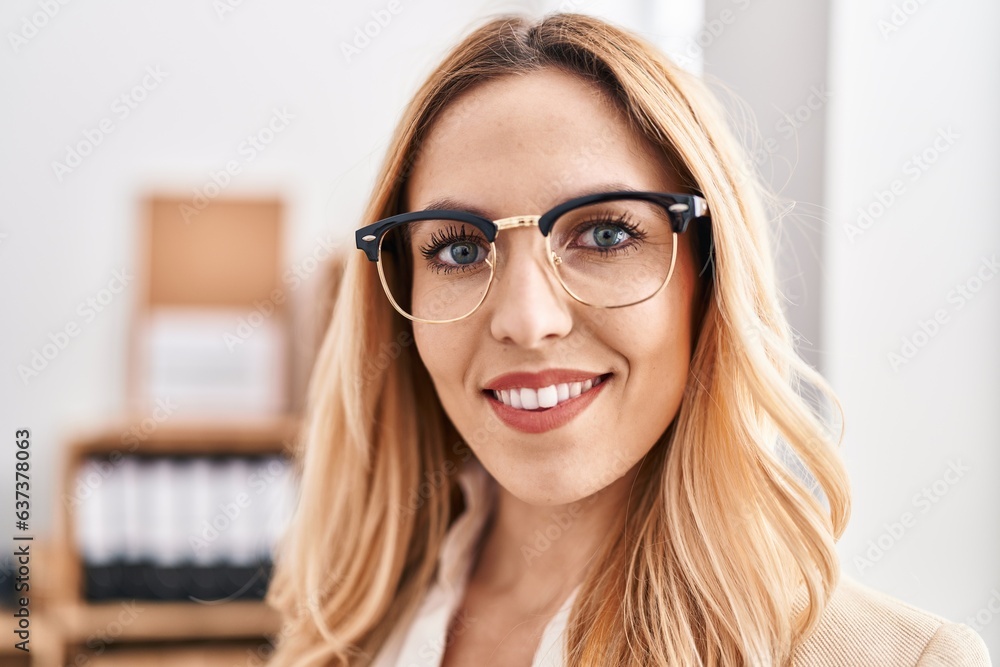 Young blonde woman business worker smiling confident at office