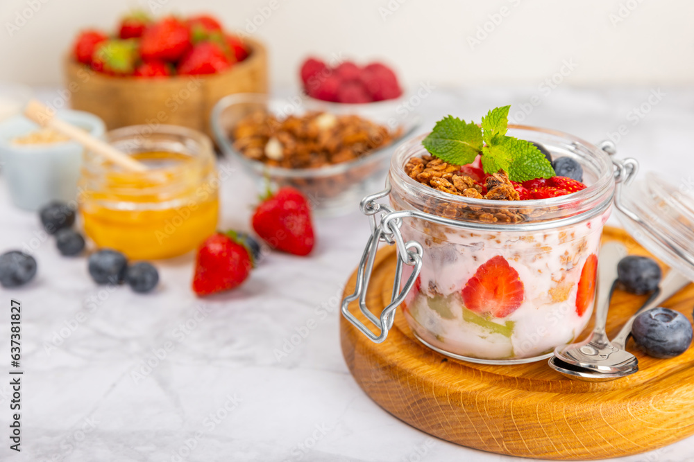 Bowl of granola with yogurt and fresh berries on a texture table. Yogurt berries, acai bowl, spirulina bowl. Healthy food, balanced breakfast. Strawberries, blueberries, kiwi, peach, almonds and chia. Bowl of granola with yogurt and fresh berries on a texture table. Yogurt berries, acai bowl, spirulina bowl. Healthy food, balanced breakfast. Strawberries, blueberries, kiwi, peach, almonds and chia.