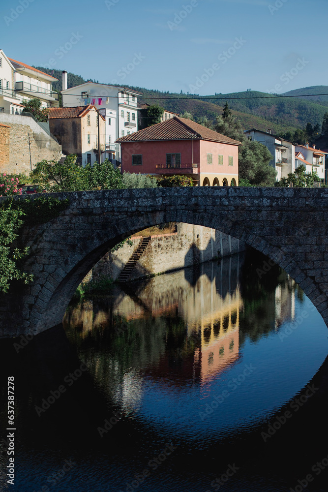 View of the pedestrian bridge in the mountain village of Vide (Seia) in the foot of Serra da Estrela, Portugal.