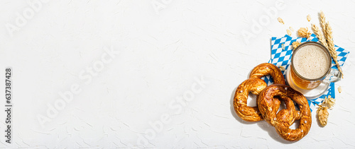 Traditional Oktoberfest set. Pretzels, beer, traditional pattern napkin. German festival food