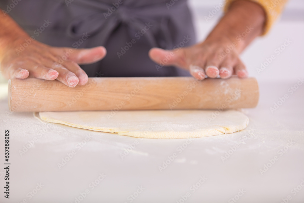 close up of hands rolling out pastry close up of hands rolling out pastry