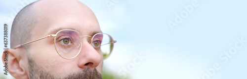 Fotografie close-up of sad young man in glasses lost in thought, sadness, anxiety, crisis,